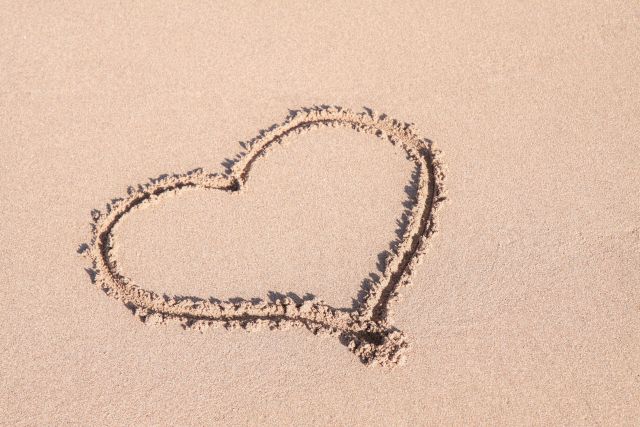 drawing of a heart in the sand