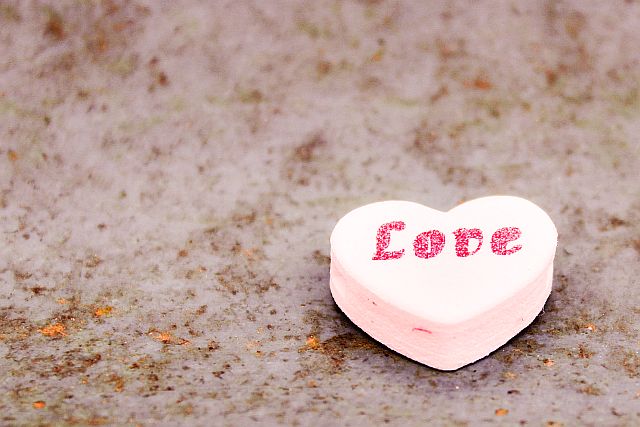 pink candy heart with the word love written on it